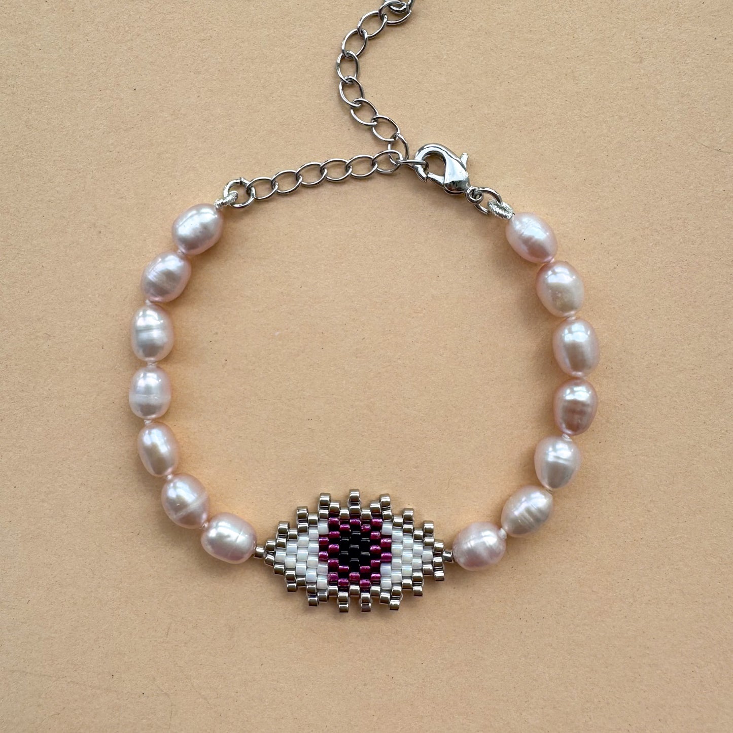 Evil eye bracelet with mate freshwater pearls