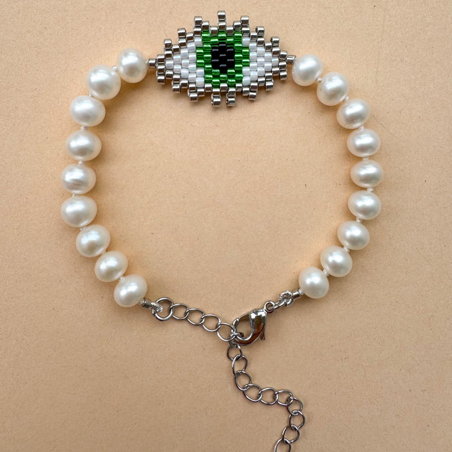 Evil eye bracelet with mate freshwater pearls