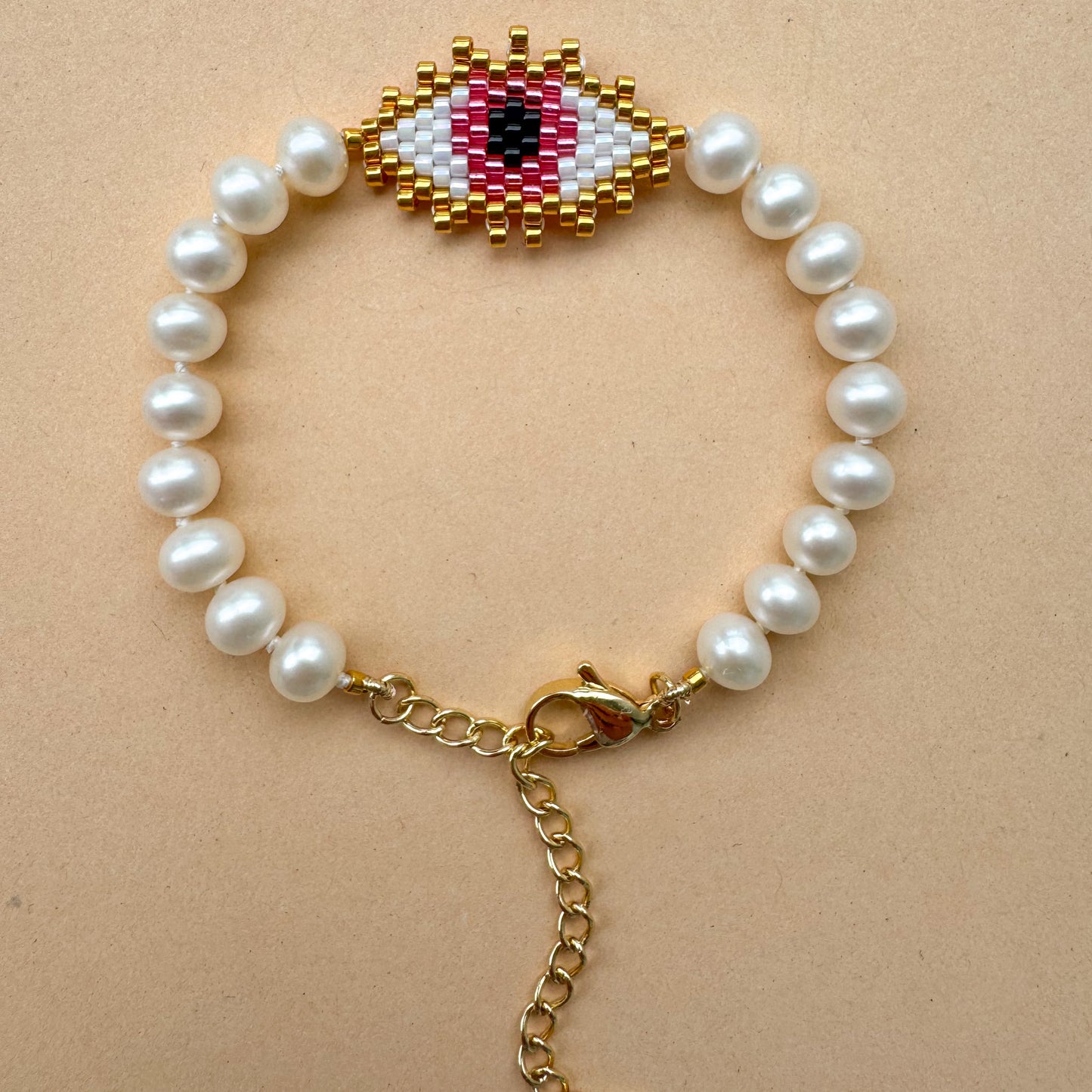 Evil eye bracelet with mate freshwater pearls