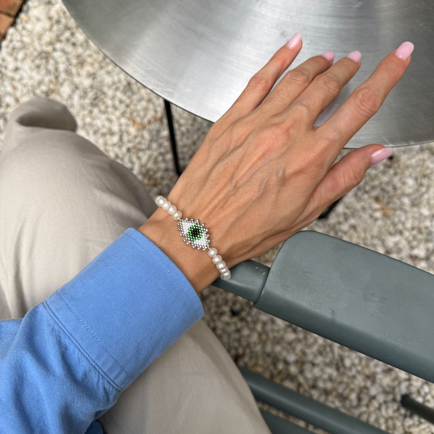 Evil eye bracelet with mate freshwater pearls