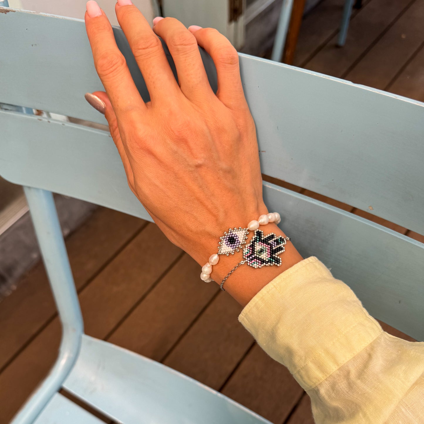 Evil eye bracelet with mate freshwater pearls