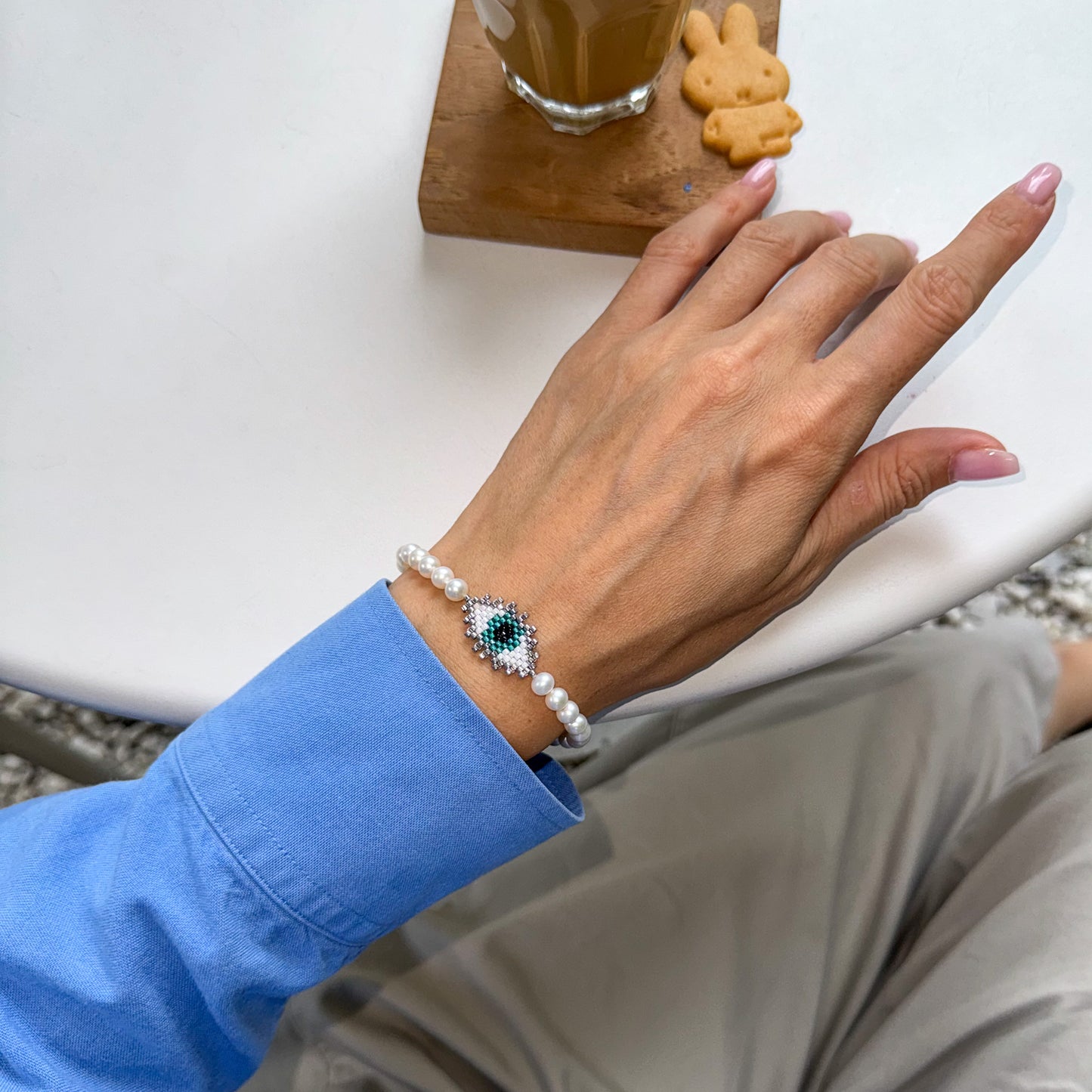 Evil eye bracelet with mate freshwater pearls