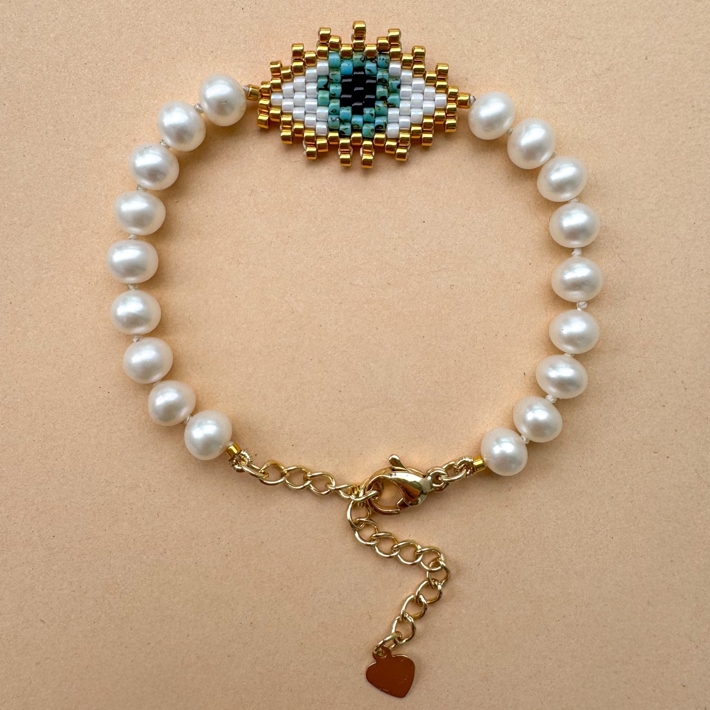 Evil eye bracelet with mate freshwater pearls
