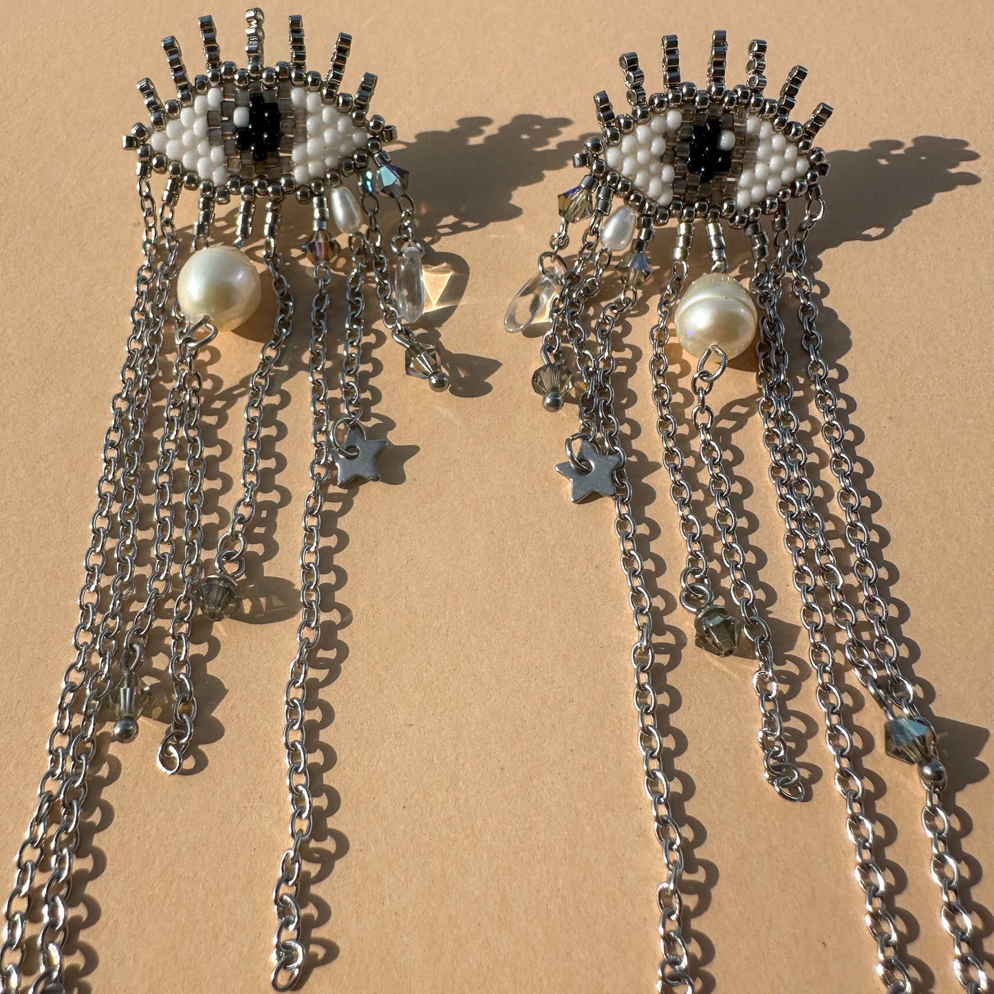 Evil Eye earrings with baroque pearls