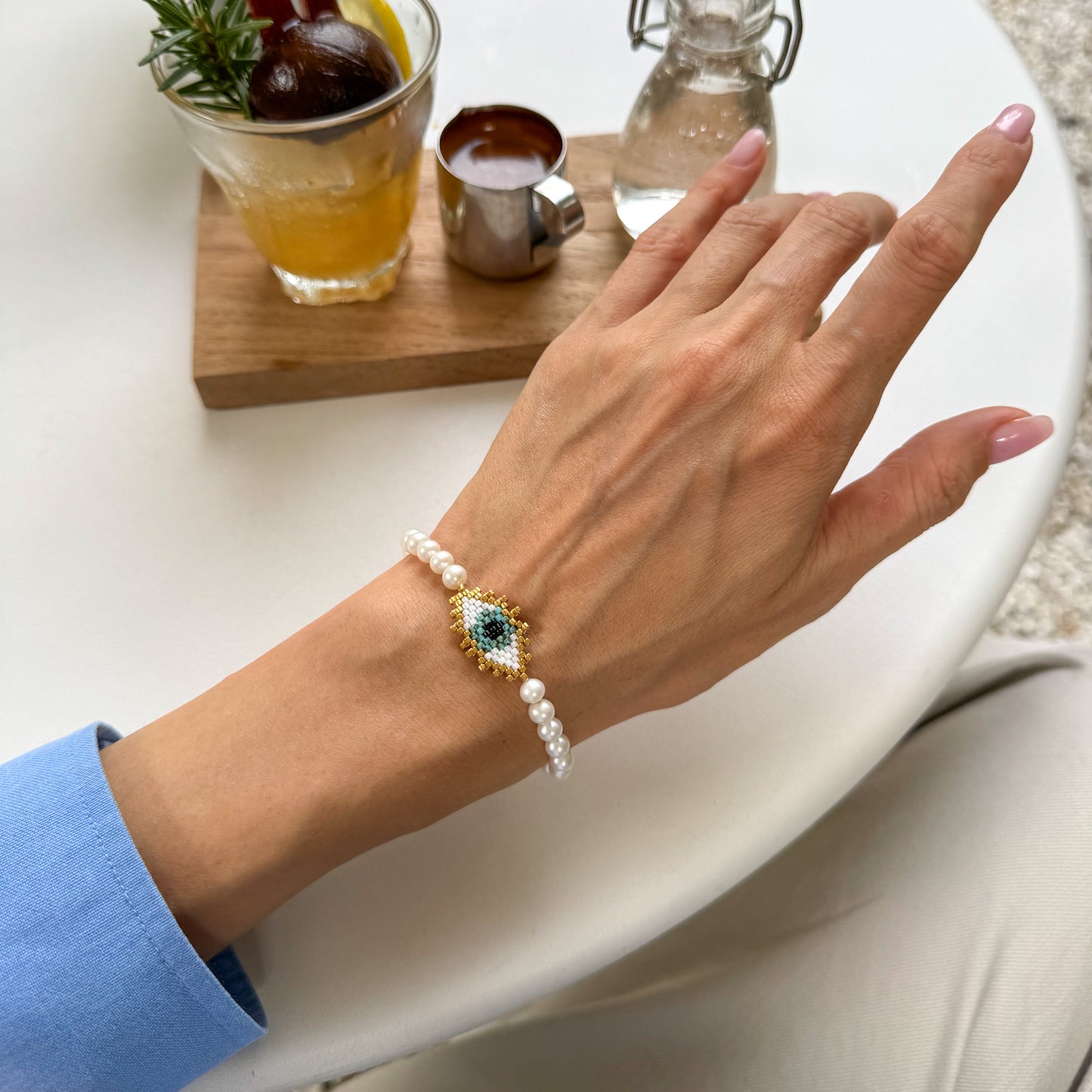 Evil eye bracelet with mate freshwater pearls